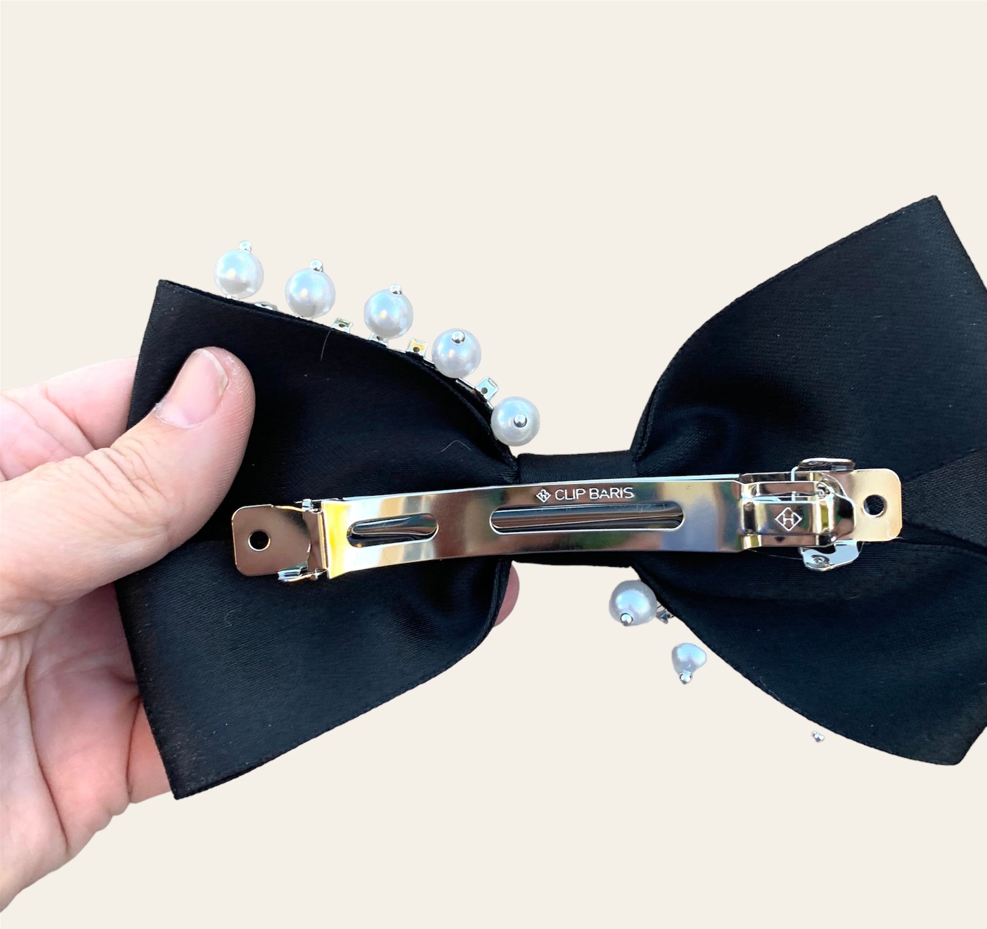 black satin and pearl hair clip on a french barrette