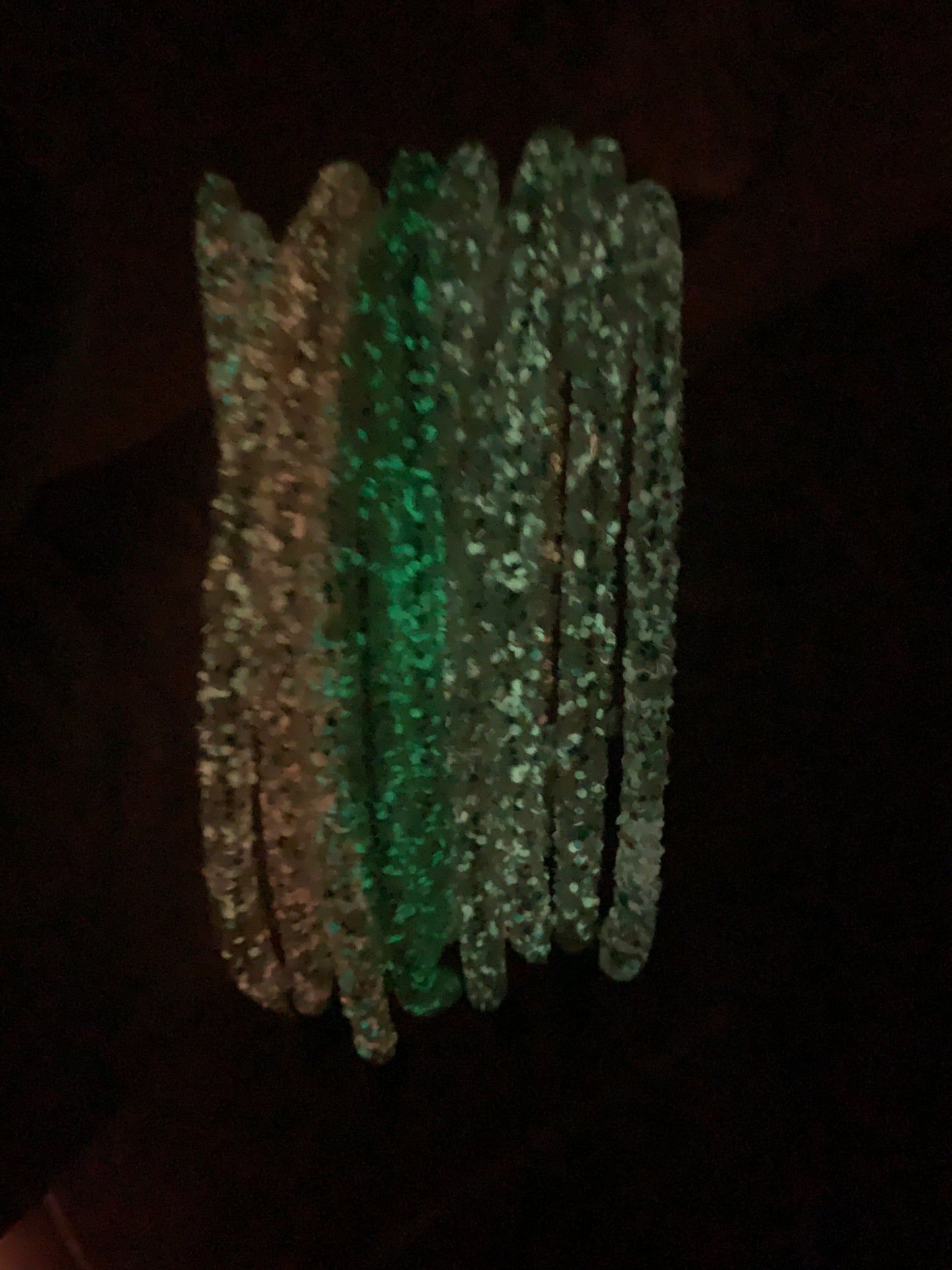 bunch of glitter glow in the dark headbands 