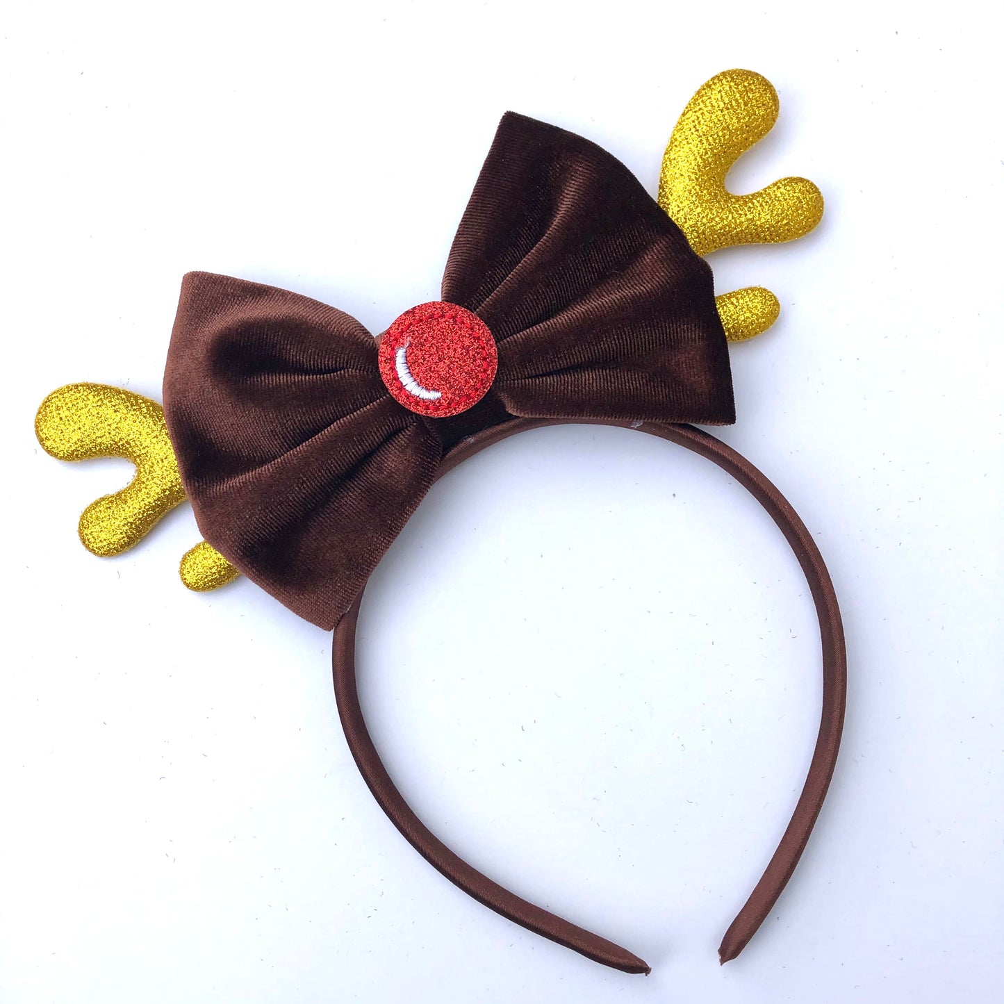 Reindeer headband with gold antlers and a red shiny nose